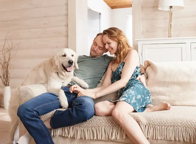 man and woman with their dog enjoying the comfort of their home o'fallon illinois