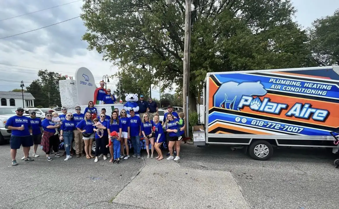 polar aire team standing in front of polar aire parage float