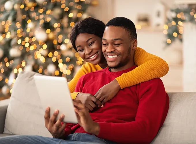 happy, cozy couple sitting in their comfortable home