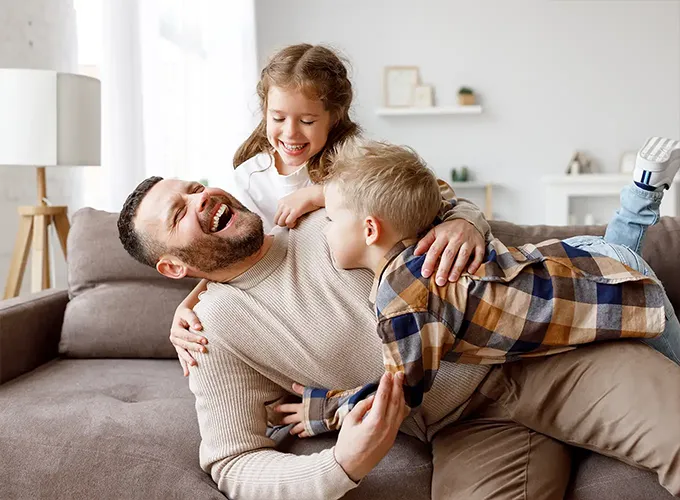 father and his two kids having fun while enjoying their comfortable living space collinsville il