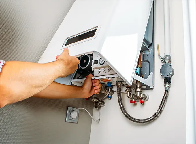 tech adjusting boiler system in collinsville il home