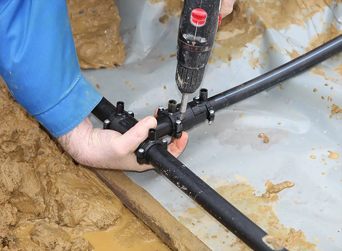 underground geothermal system being installed by heating and cooling technician collinsville illinois