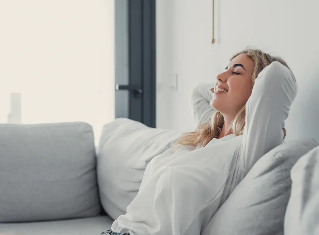 young woman relaxing, breathing in fresh, clean air collinsville il