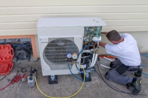 Polar—A male technician working on a circulation heat pump outside a home in O’Fallon, IL.