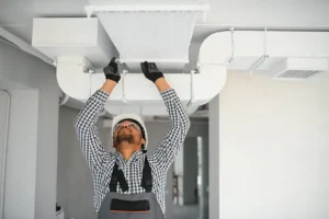 Polar—A technician providing professional air duct sealing for a home in Collinsville, IL.