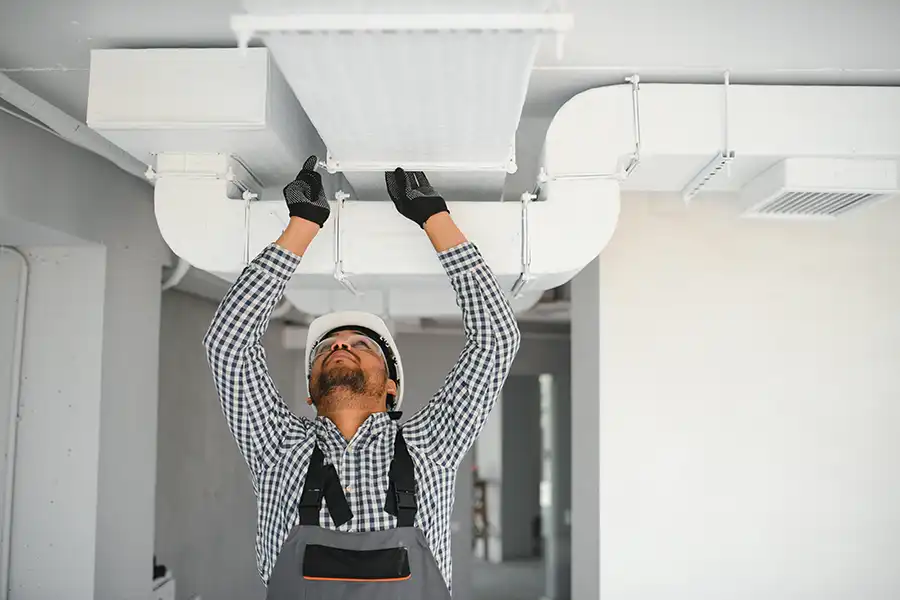Polar—A technician providing professional air duct sealing for a home in Collinsville, IL.