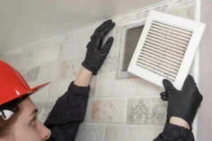 Polar—A professional cleans the air ducts in a home in Belleville, IL.