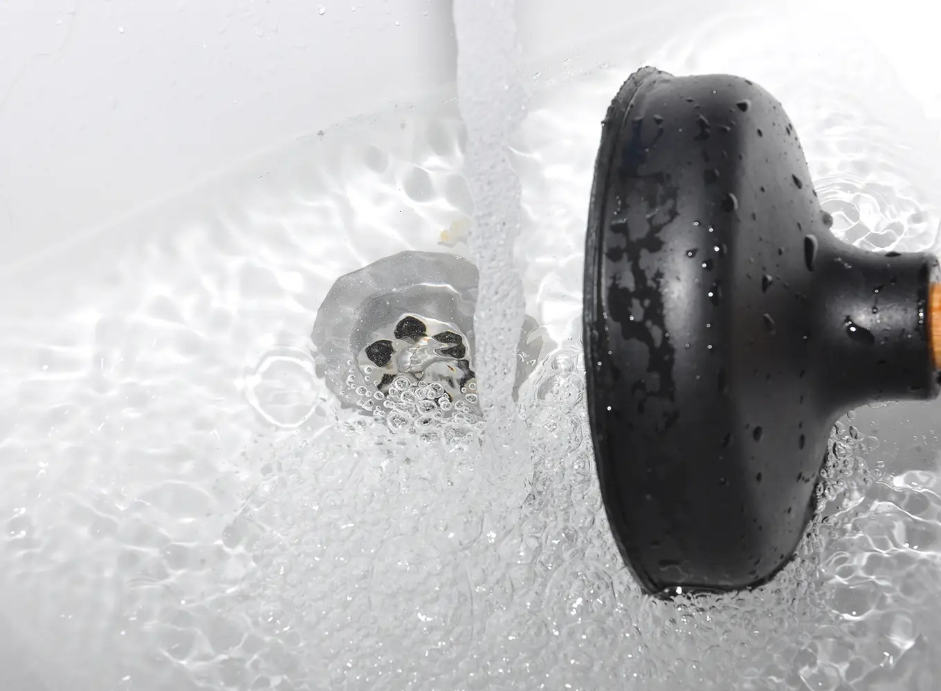 drain blockage being cleared by a drain plunger in Collinsville IL