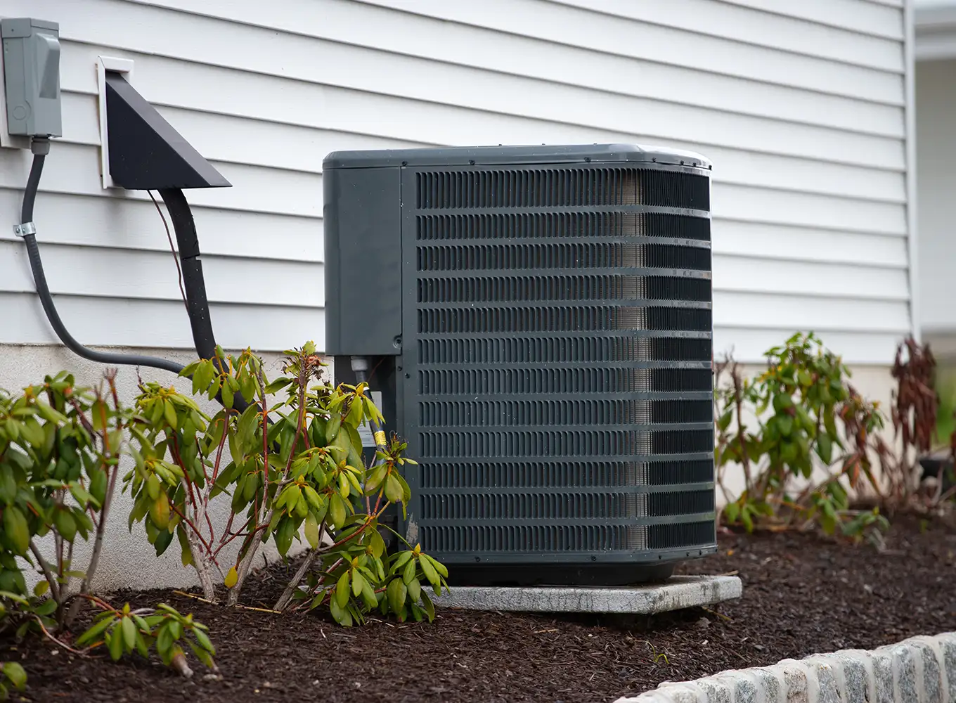 a new ac unit installed outside of a home in glen carbon illinois