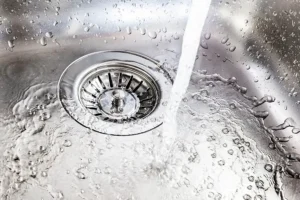 Polar—Water running down a clean drain in a sink in a Belleville, IL home.
