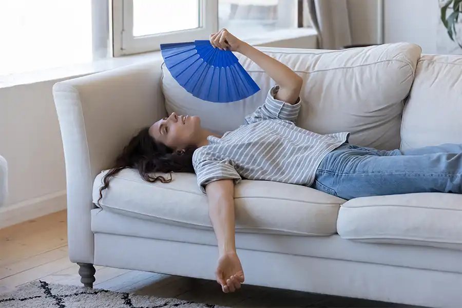 Polar—Young woman is overheated due to the high humidity in her home in O’Fallon, IL.